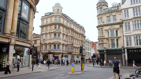 pedestrians and cyclists on oxford's cornmarket street