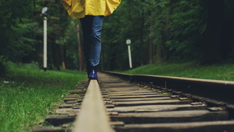 Close-Up-Of-The-Female-Legs-Walking-On-The-Railway