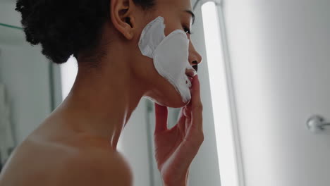 woman's skincare routine with cotton pads