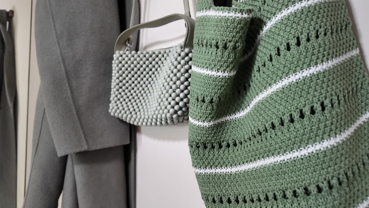 Hanging handbags and a coat