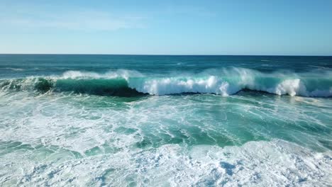 drone shot of powerful waves breaking off the north shore coast of oahu, hawaii