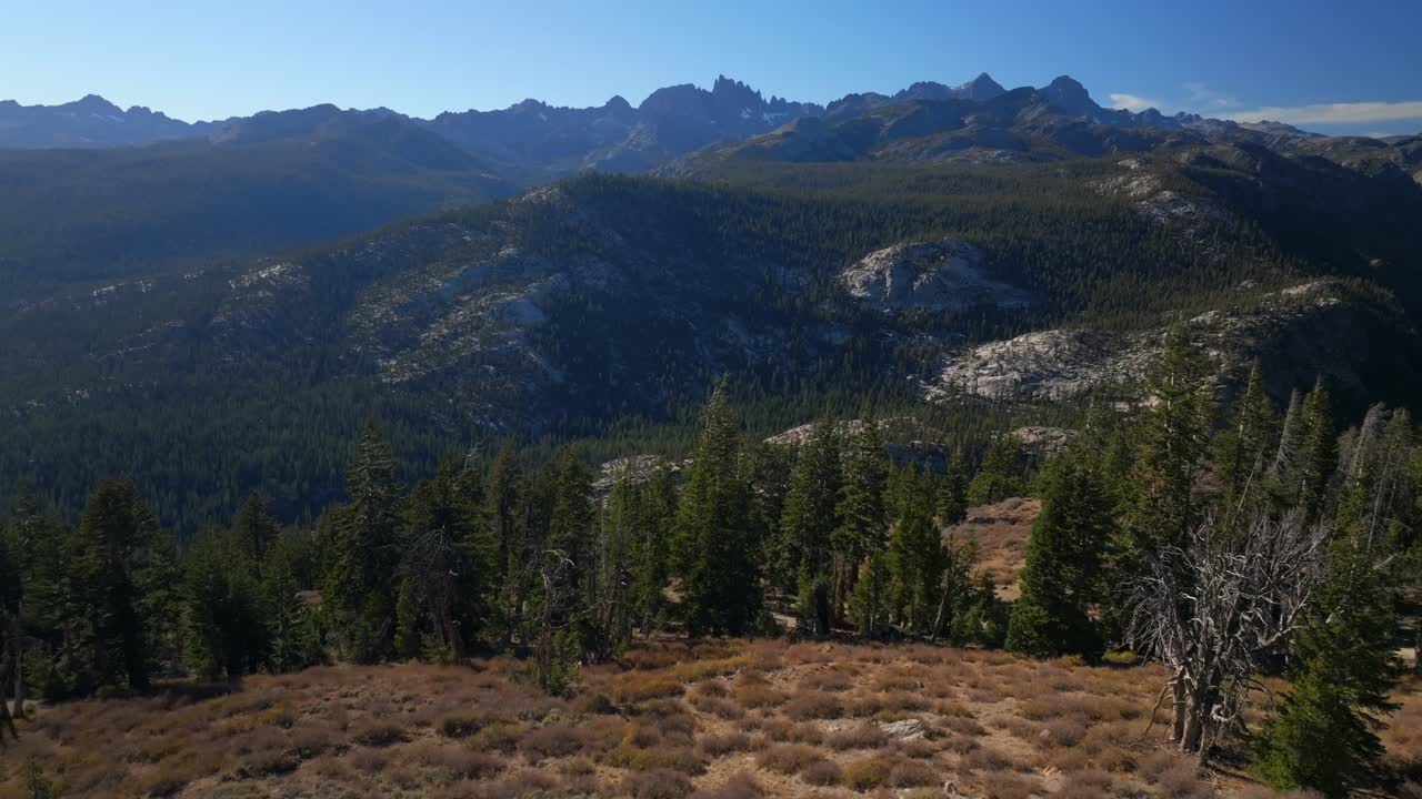 Minarets Vista Mammoth Mountain Lakes aerial drone California Sierras Banner Peak PCT Trail afternoon morning blue sky clouds nature landscape Pacific Crest Trail Yosemite forward pan up