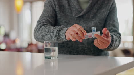 pills, water and senior person hands at home