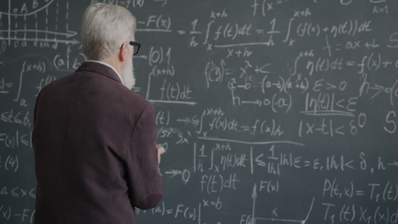 Professor Writing Equations on a Blackboard