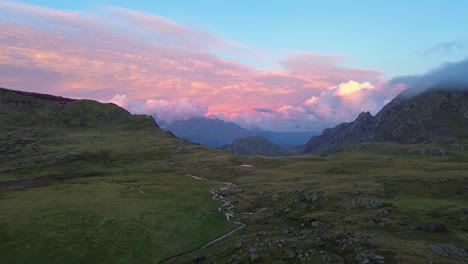 aerial view capturing serene beauty of clouds in background of the place somewhere in pyrenees in ibones de anayet, aragón, spain