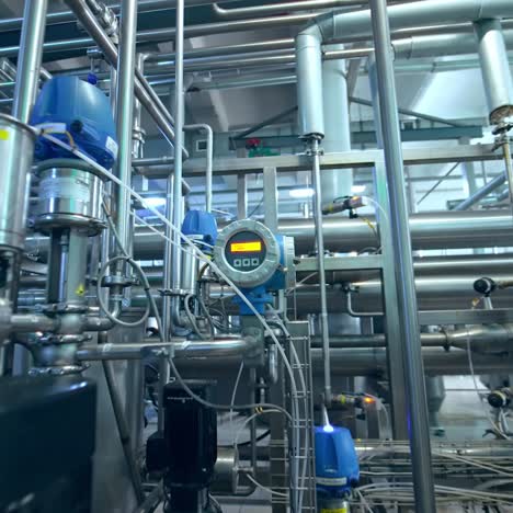 inside the milk products factory. complicated system of pipelines, cisterns and tubes and sensors at the dairy manufacturing plant