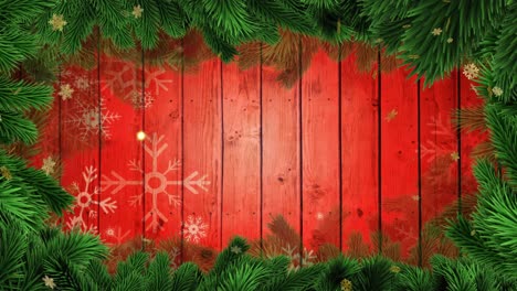 Animation-of-gold-stars-falling-on-wooden-background-with-christmas-tree-border