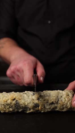 chef preparing fried sushi roll