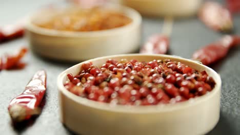 dried red chili pepper and crushed red pepper in bowl 4k