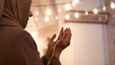 woman praying in a mosque