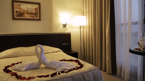 romantic hotel room with rose petals