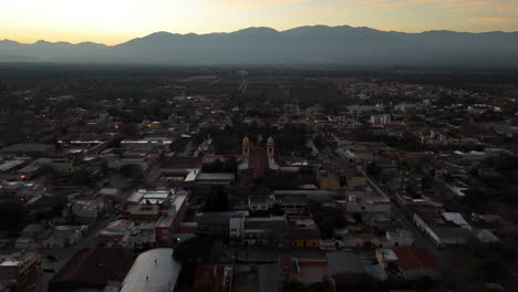 aerial view of a town at sunset in the andes mountains