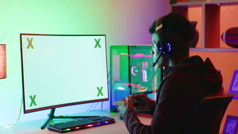 a male gamer playing video games on a screen