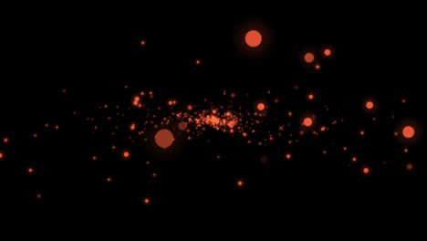 brillos de naranja sobre un fondo negro
