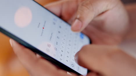 hands typing a message on a smartphone