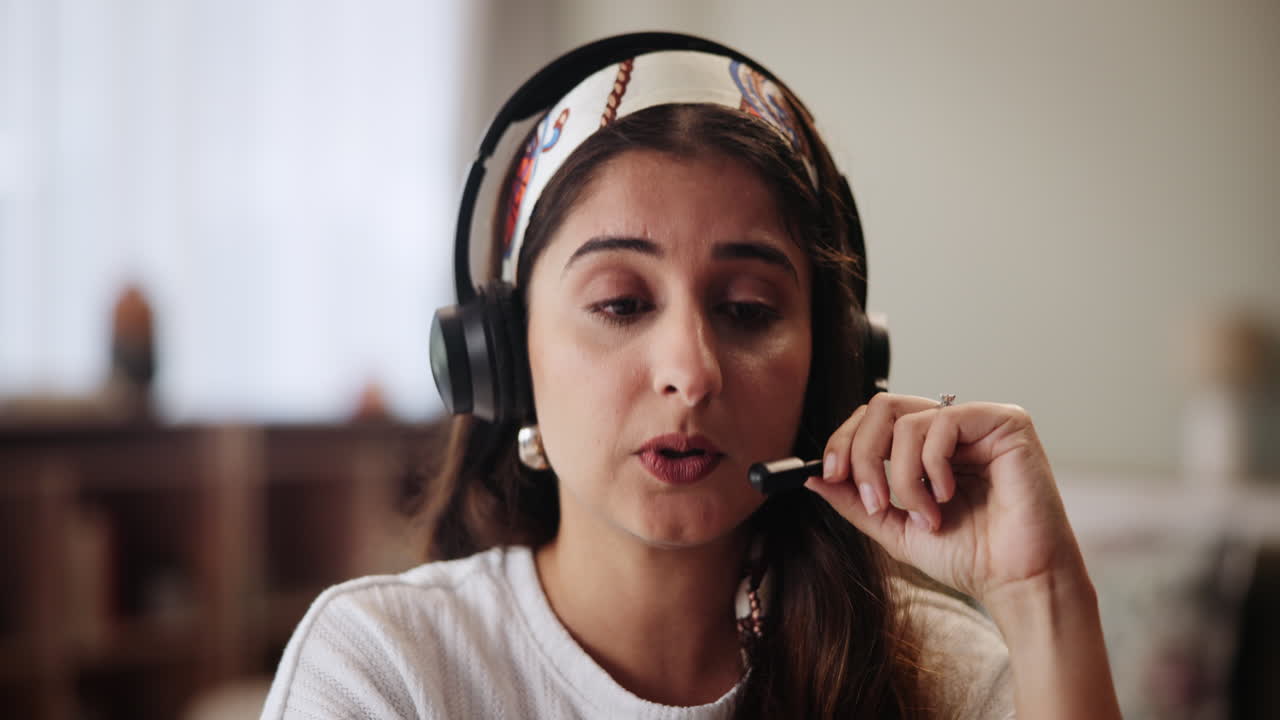 Woman wearing headset during video call