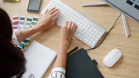 woman working on computer at a desk