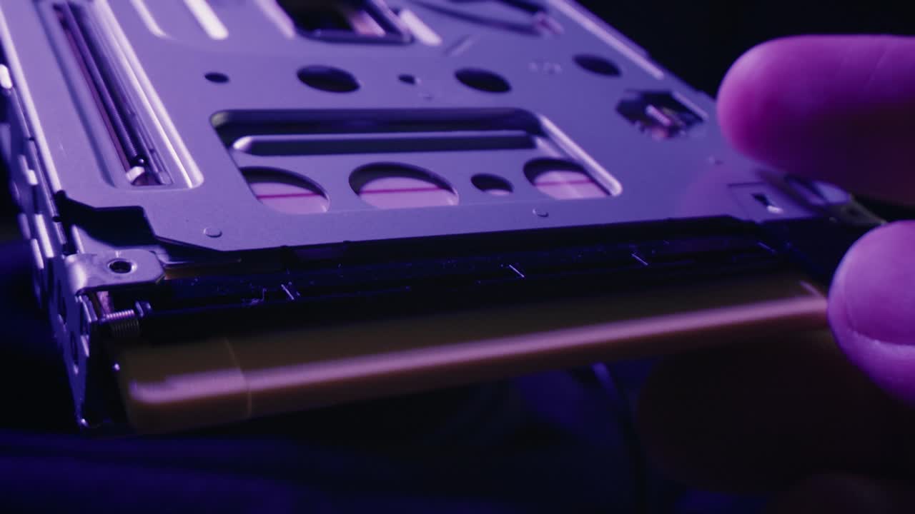 Floppy disc FDD close up, Using diskette for old PC computer macro. Archive programme or Music recorder, playing retro computer games. Vintage device for office, obsolete technology. . High quality 4k footage