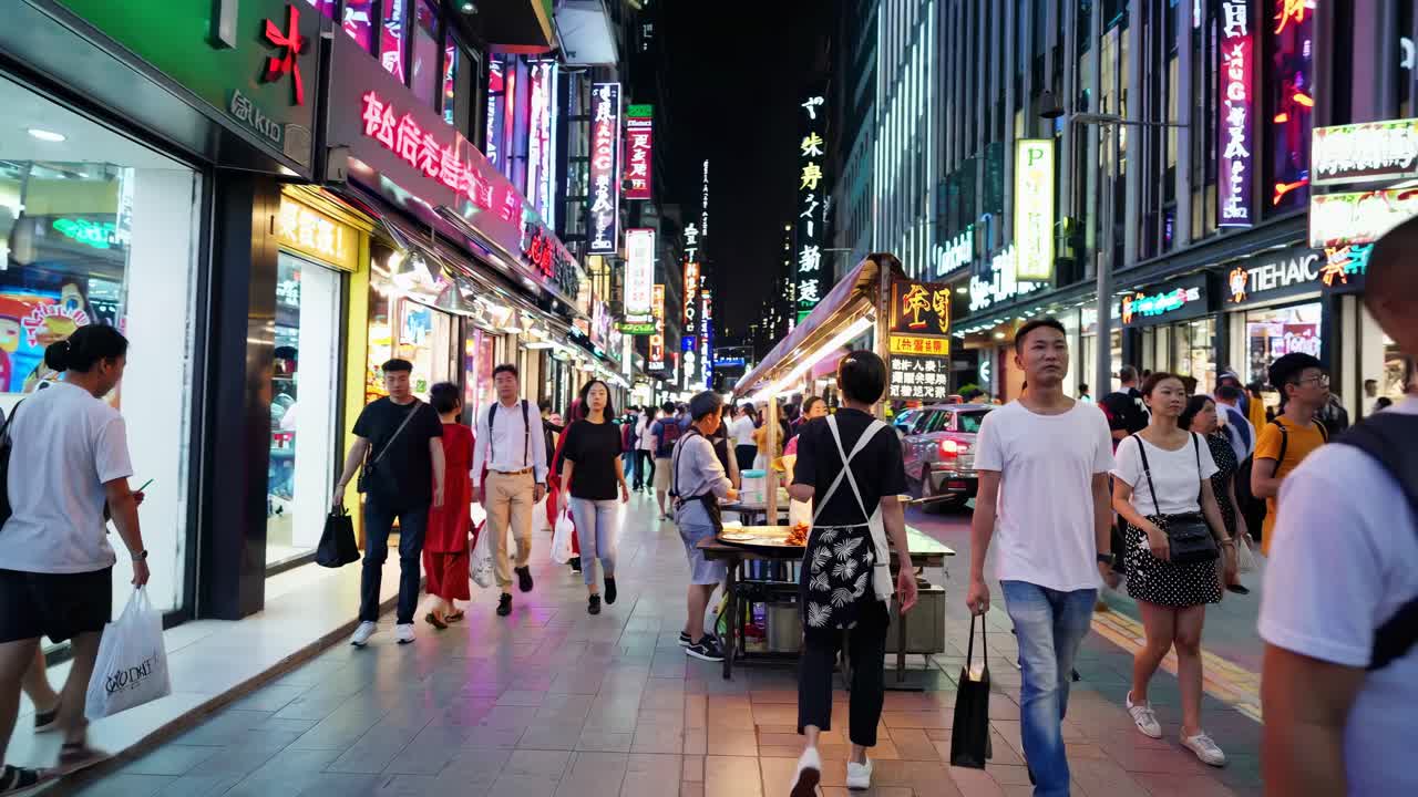 Vibrant street market scene at night, captured from a low angle