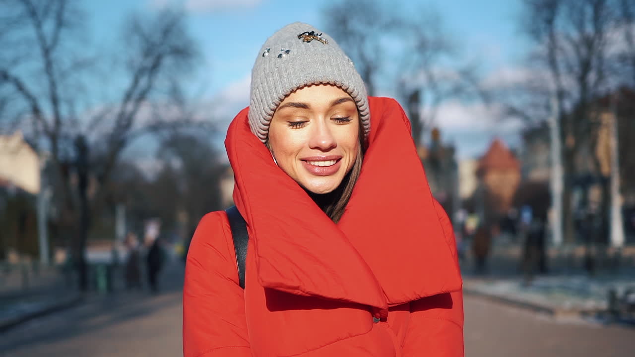 Woman in winter clothes on a sunny day
