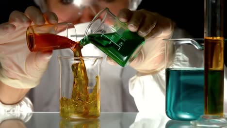 animation of graph over caucasian female scientist holding beakers