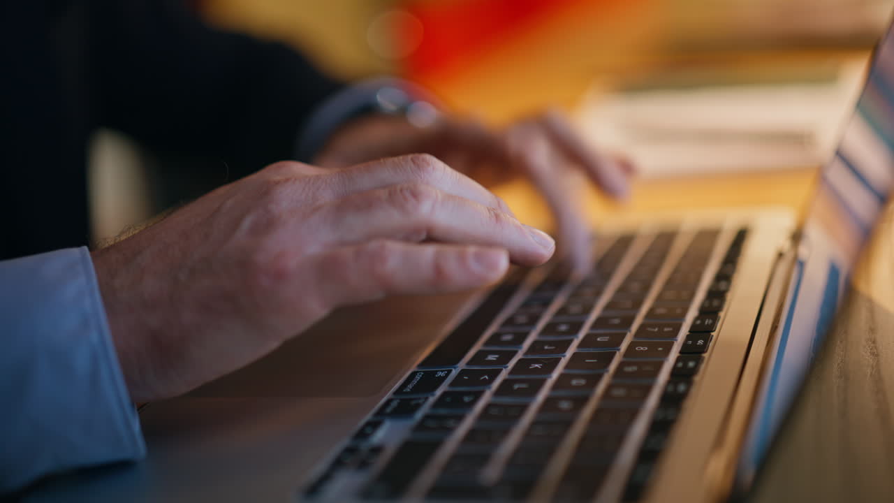 Closeup thoughtful employee working overtime creating project. Freelancer typing