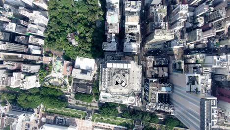 central hong kong, top down aerial view of traffic and city skyscrapers