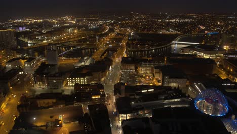 aerial flyover of belfast city centre and lagan river at night