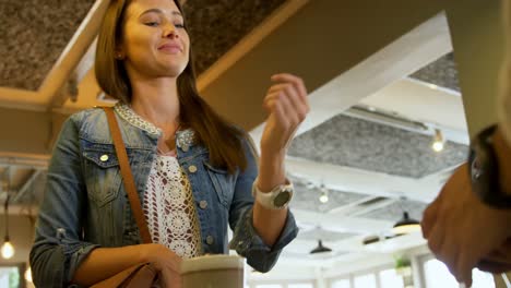 Waiter-taking-payment-by-smartwatch-4k