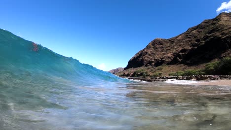 Extreme-Slow-Motion-shot-of-being-inside-the-small-barrel-of-a-shore-break-wave-on-a-Hawaiian-Beach