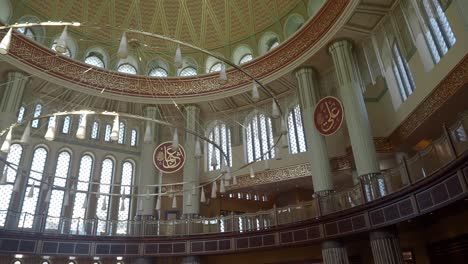 interior of a mosque with a large chandelier and ornate decorations