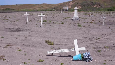 the graves of unknown mexican immigrant hispanic farm workers are marked by crosses in a graveyard cemetery near guadeloupe 3