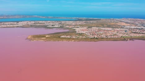 aerial view. salt sea water evaporation ponds with pink colour