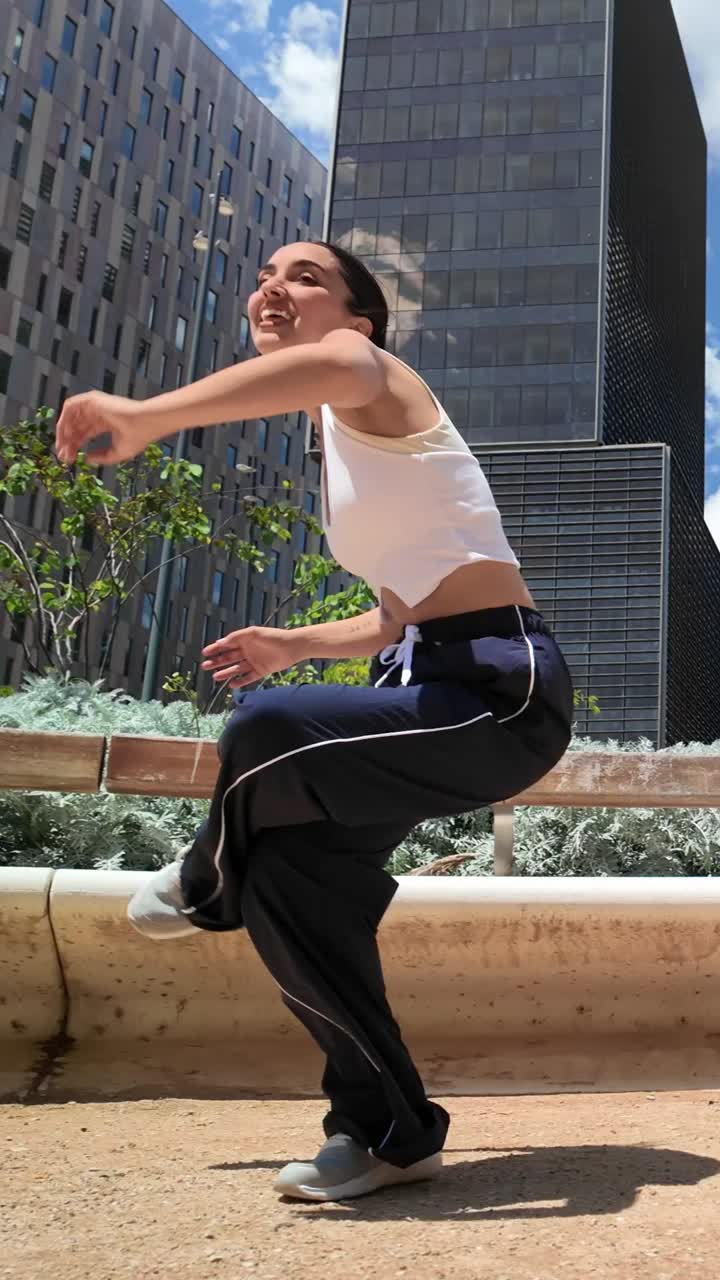 Woman dancing in urban environment