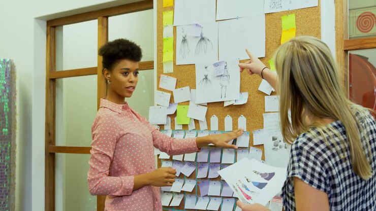 Fashion designer discussing on sticky note 4k