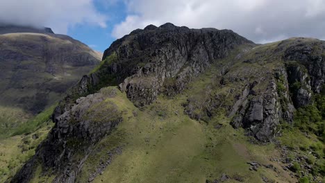 4k aerial drone footage zooming in on mountain with large rocks in scottish highlands scotland uk landscape