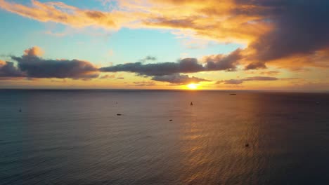 beautiful paradise ocean sunset by waikiki beach in honolulu, hawaii