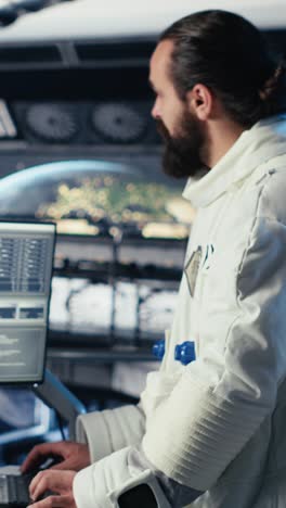 vertical video astronauts in advanced technology spacecraft working together