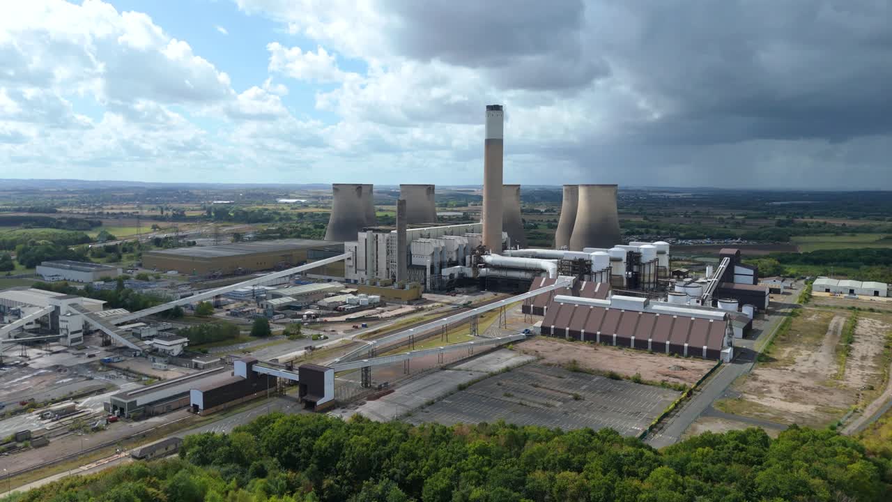 Drone view of retired coal power site with dramatic sky and decaying industrial structures near Nottingham