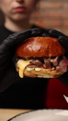 person eating a delicious burger