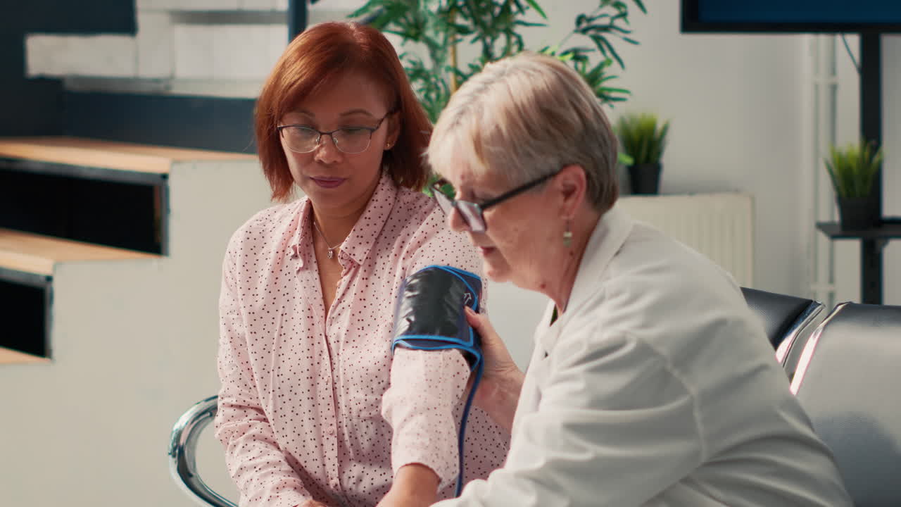 Doctor measuring patient's blood pressure