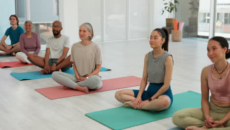 people, group and yoga on mat in studio