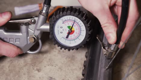 bike repair kit and inflating empty bike tire with compressor and manometer