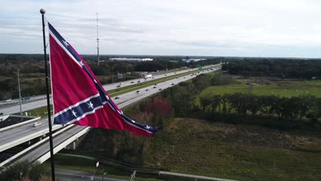 confederate flag in front of a highway