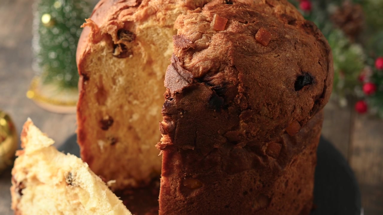 Cutting traditional Italian Panettone for christmas