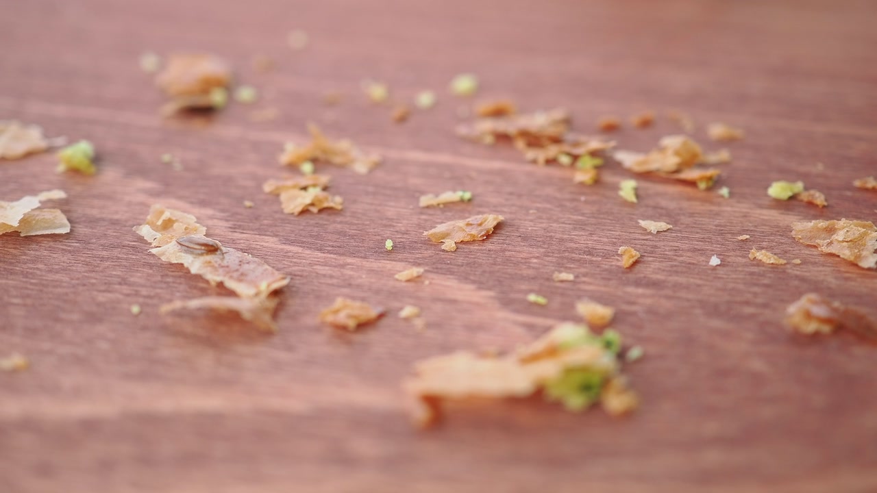 Close-up of Scattered Pastry Crumbs on a Wooden Table