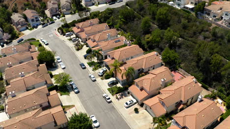 aerial view of a suburban residential neighborhood with houses and street