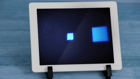 animation of blue squares flickering data processing on tablet screen