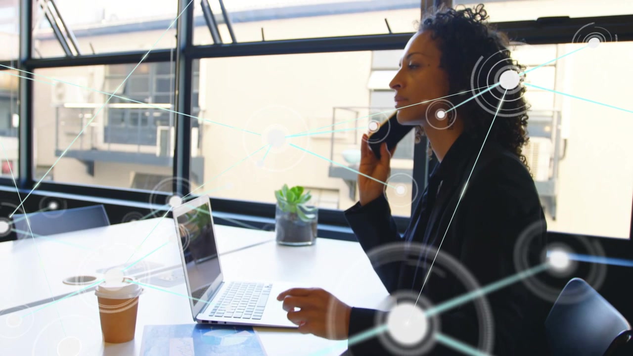 Network overlays appearing, woman typing on laptop then picking up phone, calling for tech sync