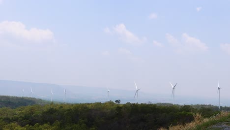 wind farm landscape with rotating turbines and clear skies